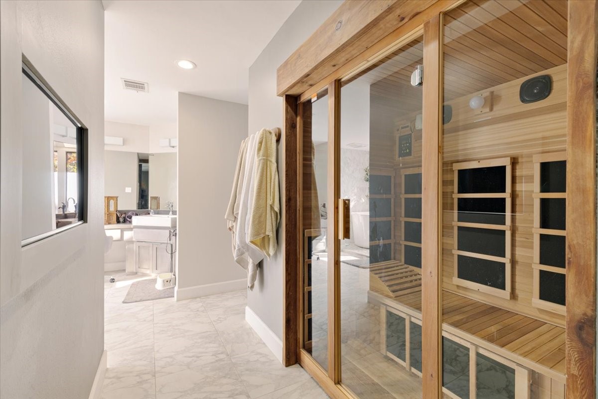 201 Vanderpool Lane, Unit 130 Houston, TX 77024 - Photo 14 of 23 a view of a bathroom with a tub and windows