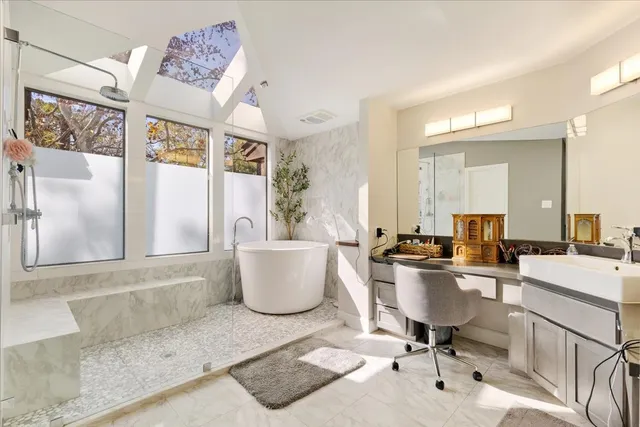 a view of a dining room with furniture and a potted plant
