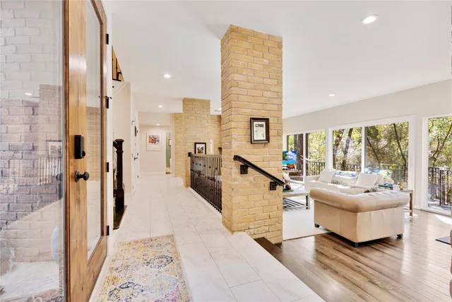 a very nice looking living room with a large window