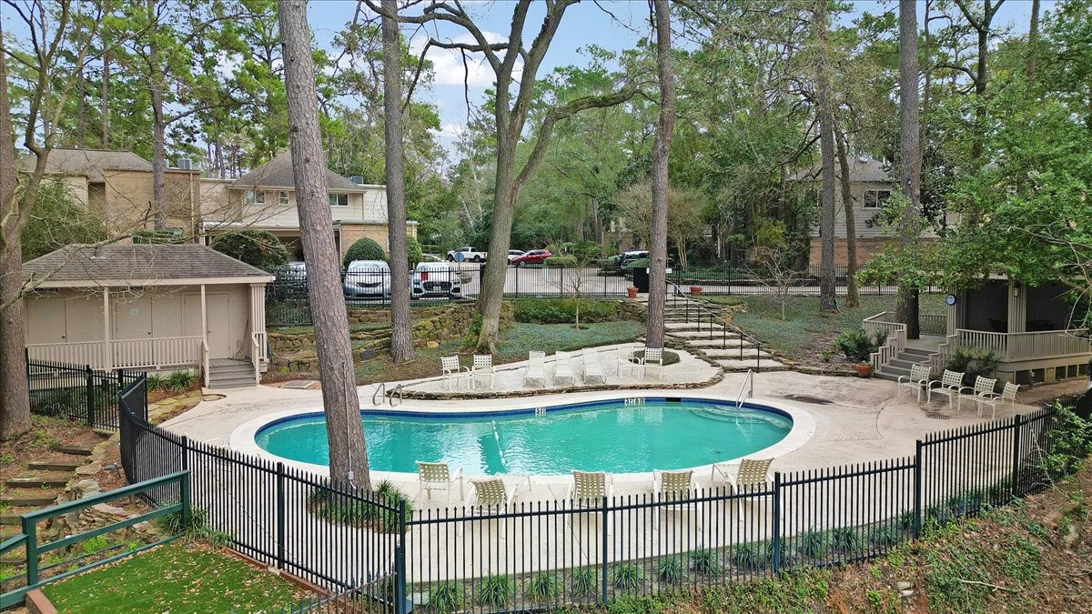 201 Vanderpool Lane, Unit 130 Houston, TX 77024 - Photo 22 of 23 a view of a house with backyard and sitting area