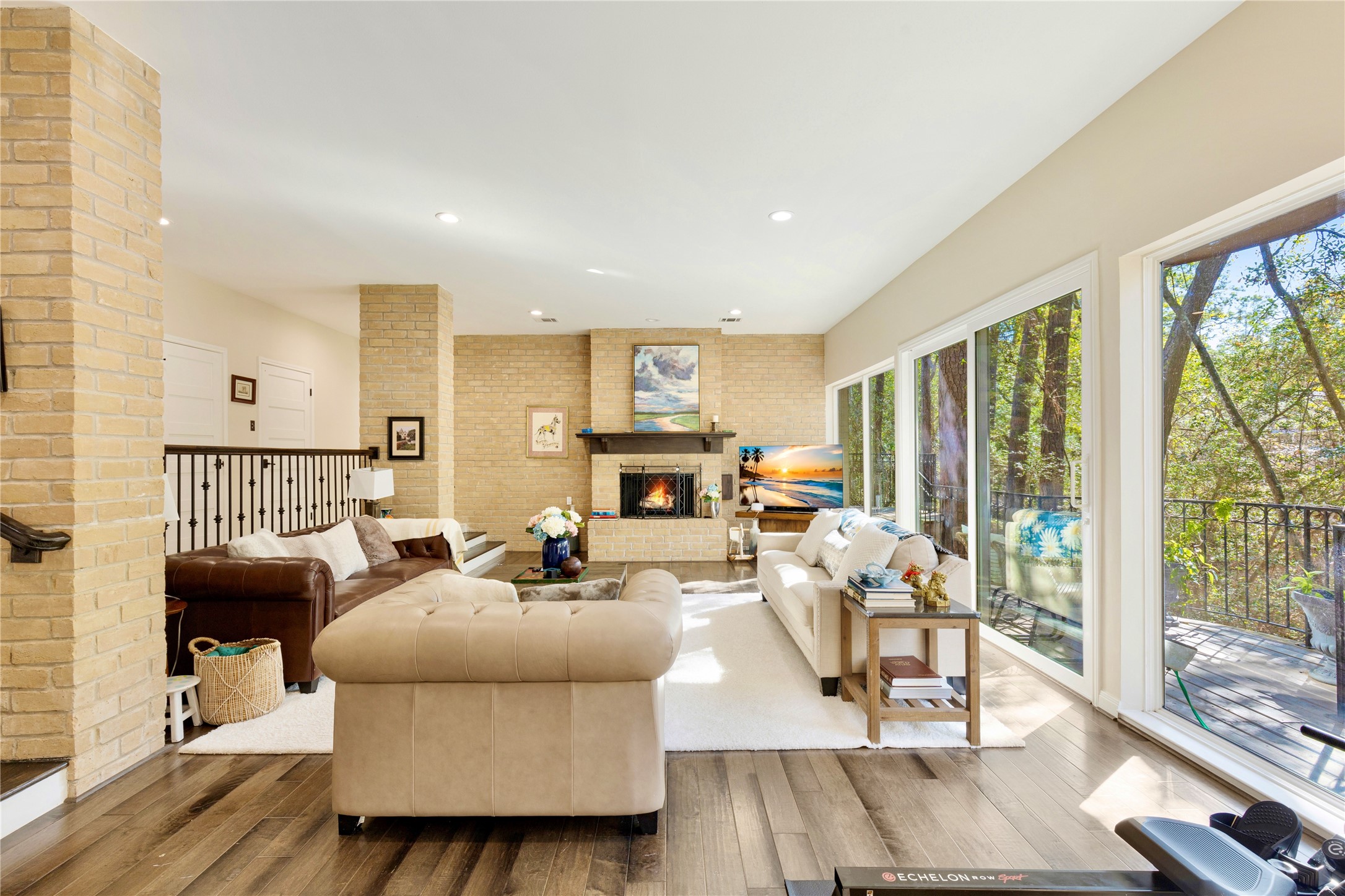 201 Vanderpool Lane, Unit 130 Houston, TX 77024 - Photo 3 of 23 a living room with fireplace furniture and a large window
