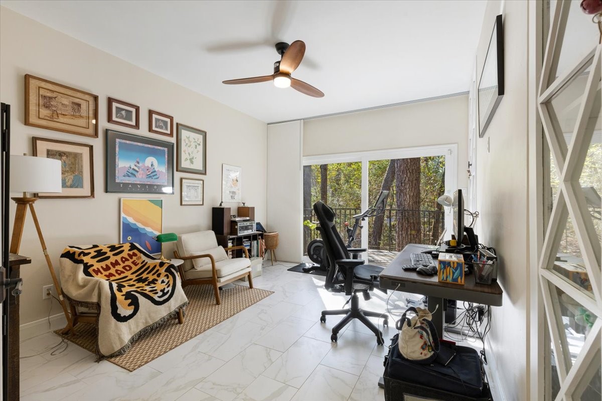 201 Vanderpool Lane, Unit 130 Houston, TX 77024 - Photo 10 of 23 a living room with furniture and a window
