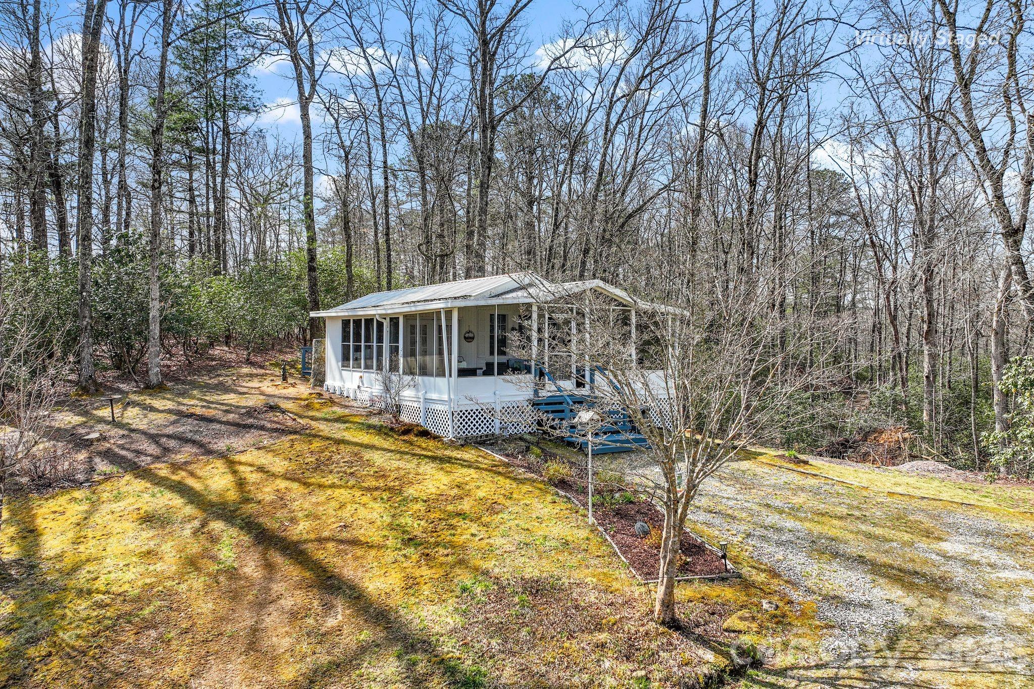 54 South Kimiko Lane Balsam Grove, NC 28708 - Photo 12 of 46 a view of house with backyard and swimming pool