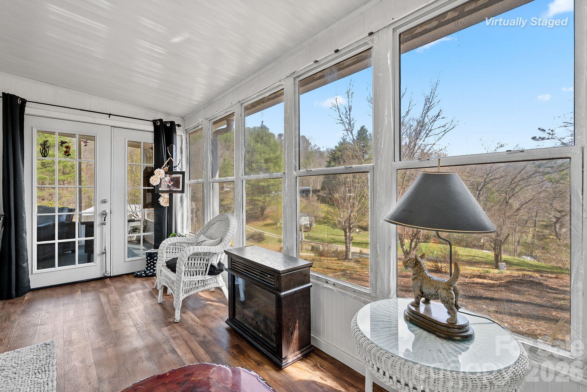 54 South Kimiko Lane Balsam Grove, NC 28708 - Photo 17 of 46 a living room with furniture and a flat screen tv