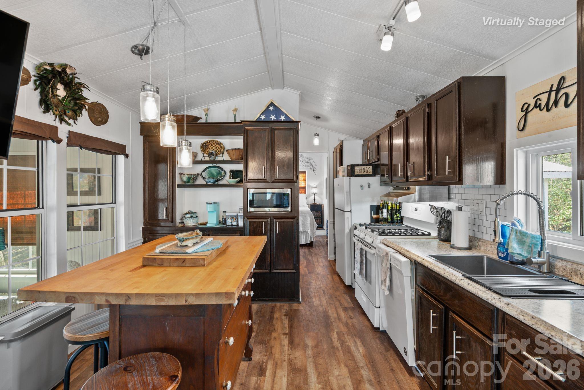 54 South Kimiko Lane Balsam Grove, NC 28708 - Photo 18 of 46 a kitchen with stainless steel appliances granite countertop a sink stove and refrigerator