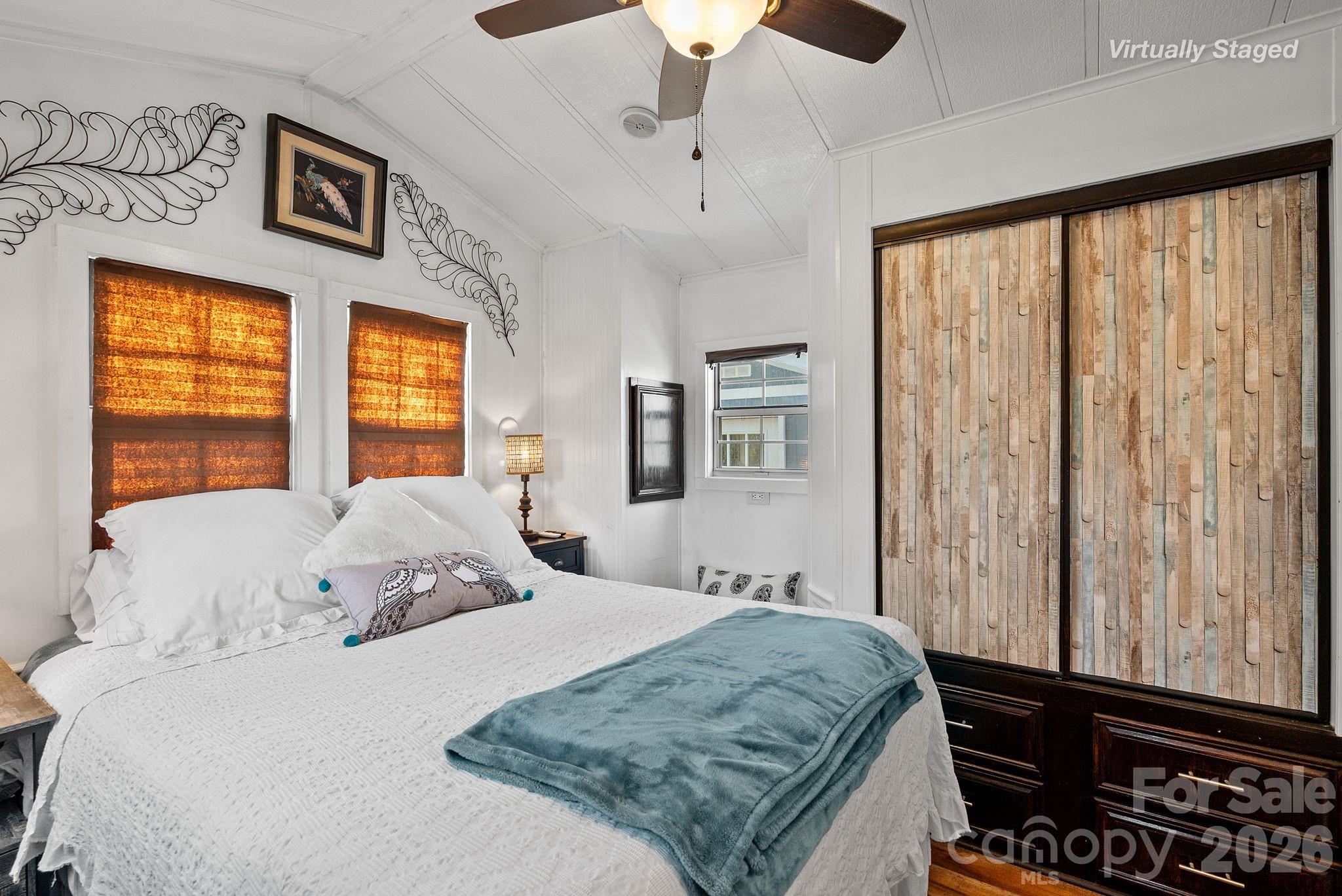 54 South Kimiko Lane Balsam Grove, NC 28708 - Photo 23 of 46 a bedroom with a bed and a window