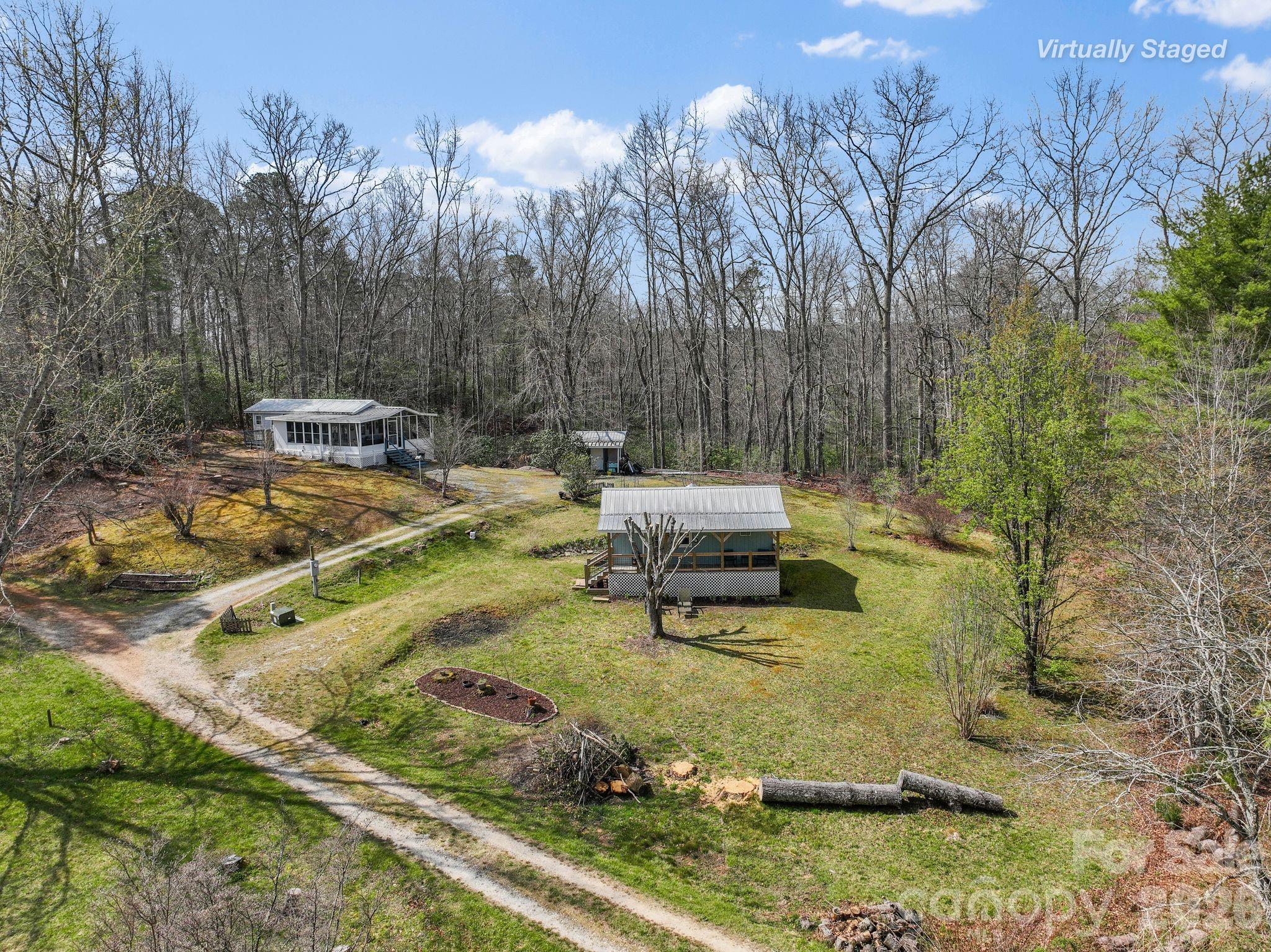 54 South Kimiko Lane Balsam Grove, NC 28708 - Photo 26 of 46 a view of yard with swimming pool and trees in the background
