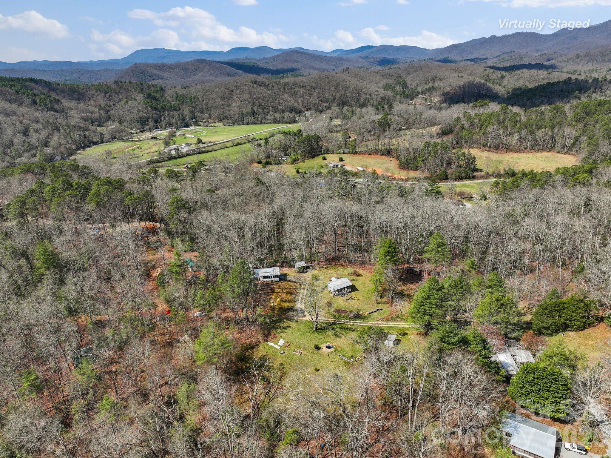 54 South Kimiko Lane Balsam Grove, NC 28708 - Photo 30 of 46 a view of a town with mountains in the background