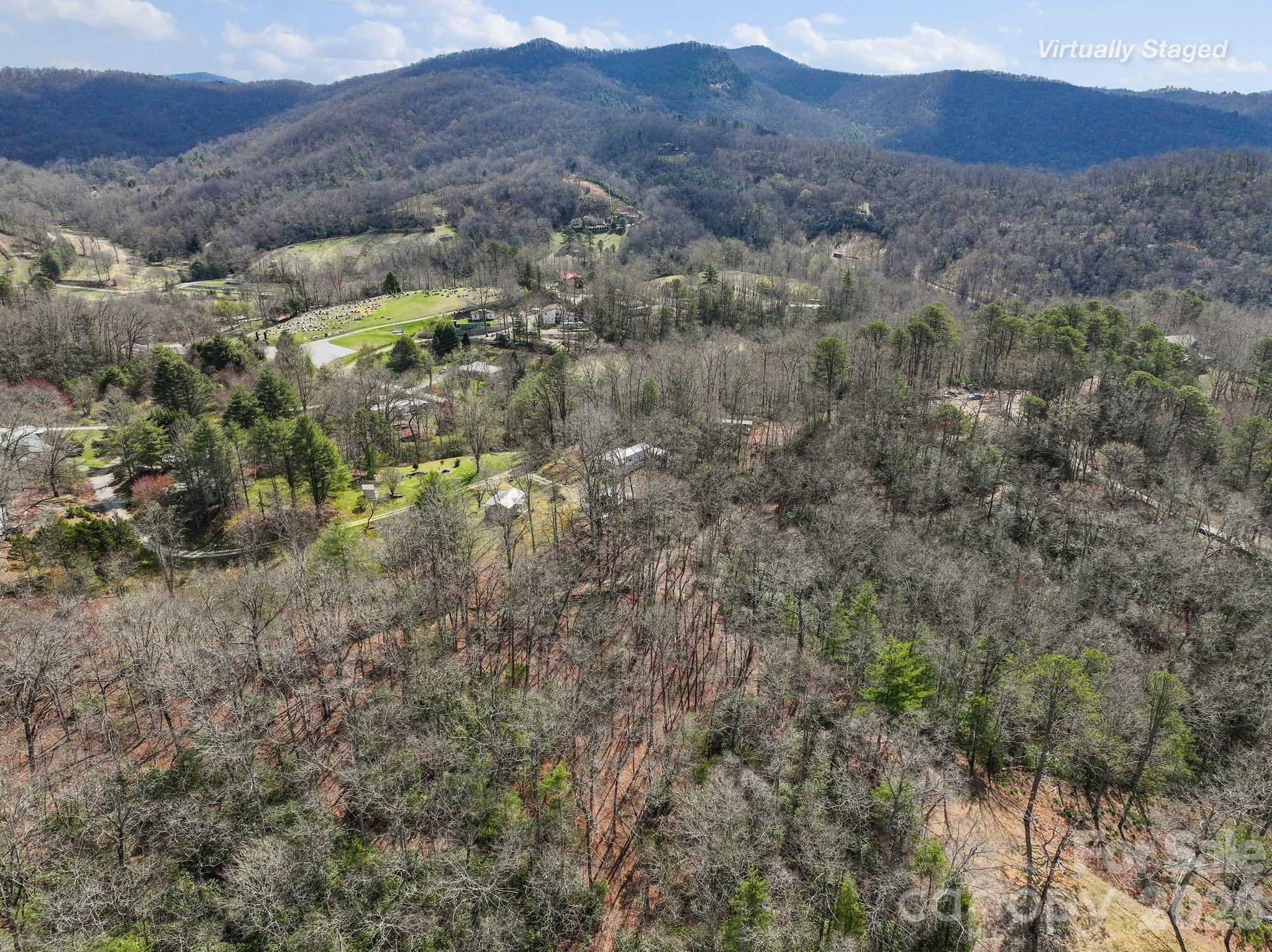 54 South Kimiko Lane Balsam Grove, NC 28708 - Photo 33 of 46 a view of a forest with mountains in the background