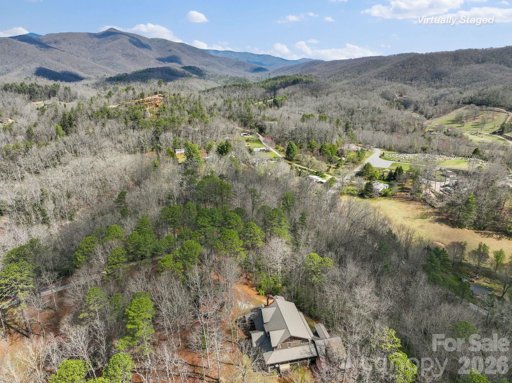 54 South Kimiko Lane Balsam Grove, NC 28708 - Photo 34 of 46 a view of a lush green hillside and houses