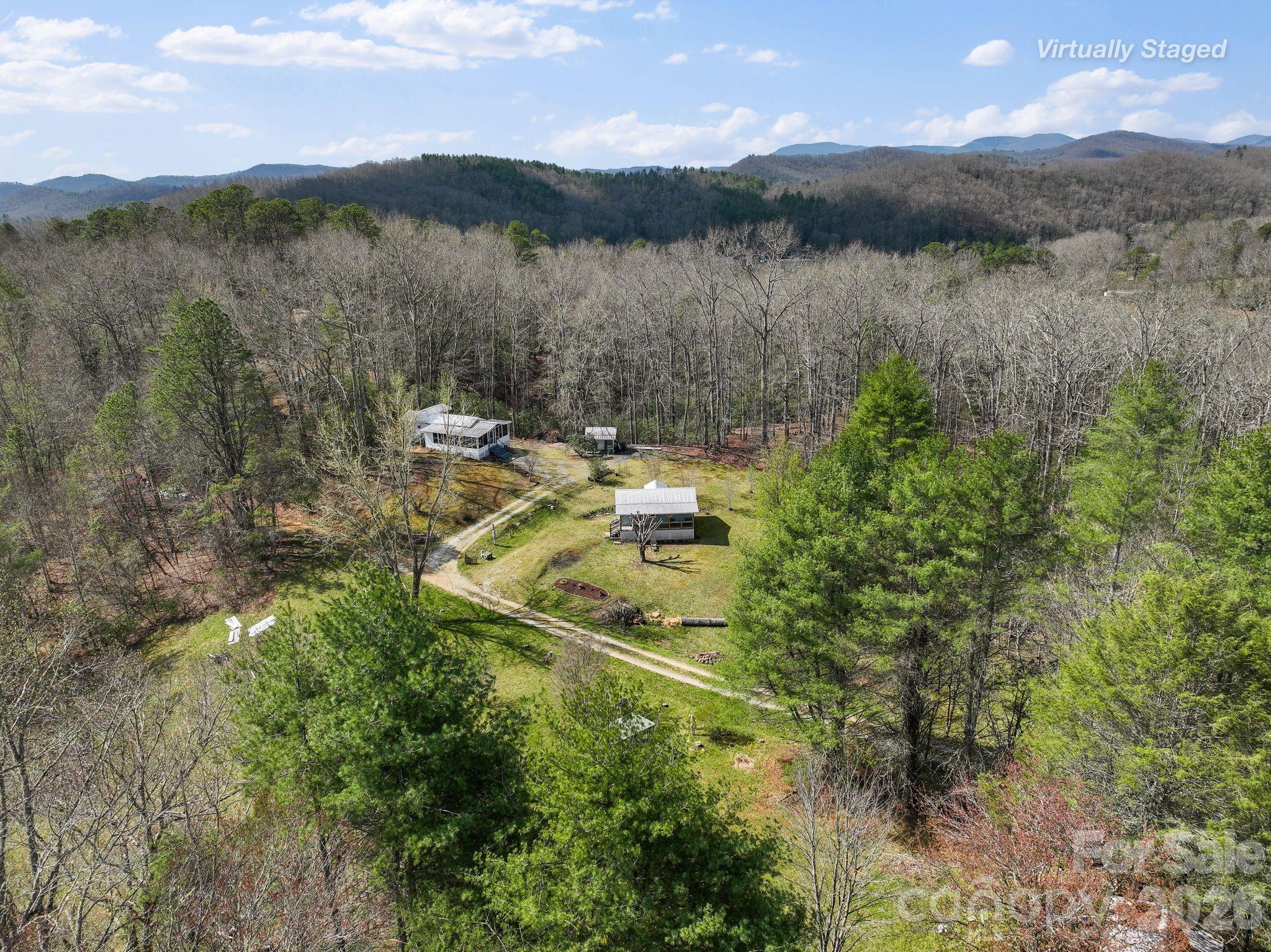 54 South Kimiko Lane Balsam Grove, NC 28708 - Photo 35 of 46 a view of a lake with mountains in the background