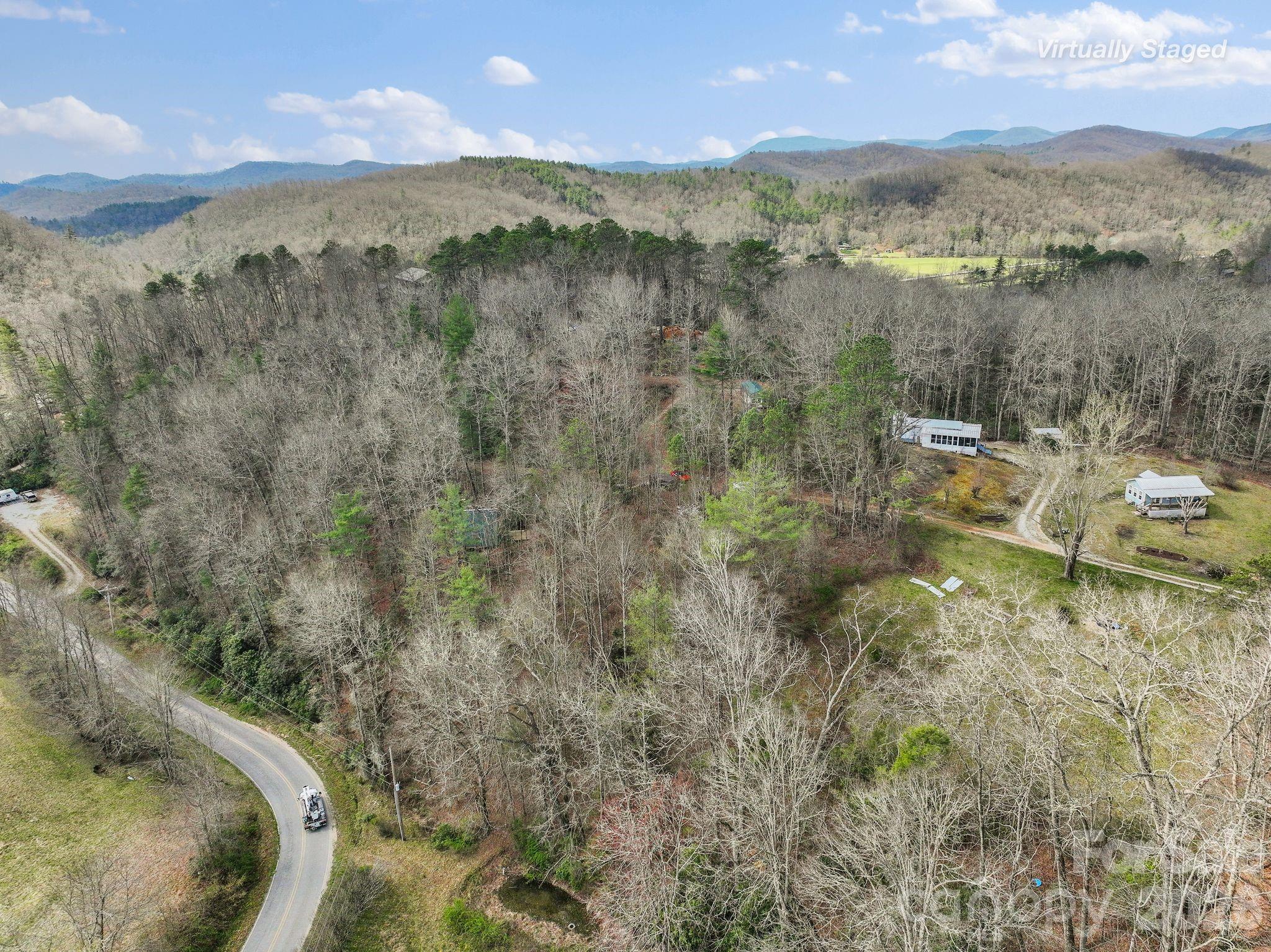 54 South Kimiko Lane Balsam Grove, NC 28708 - Photo 39 of 46 a view of a lake with a mountain in the background