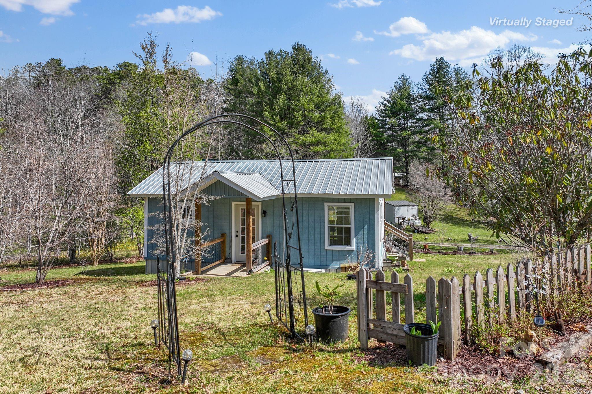 54 South Kimiko Lane Balsam Grove, NC 28708 - Photo 4 of 46 a view of a house with a yard balcony and tree