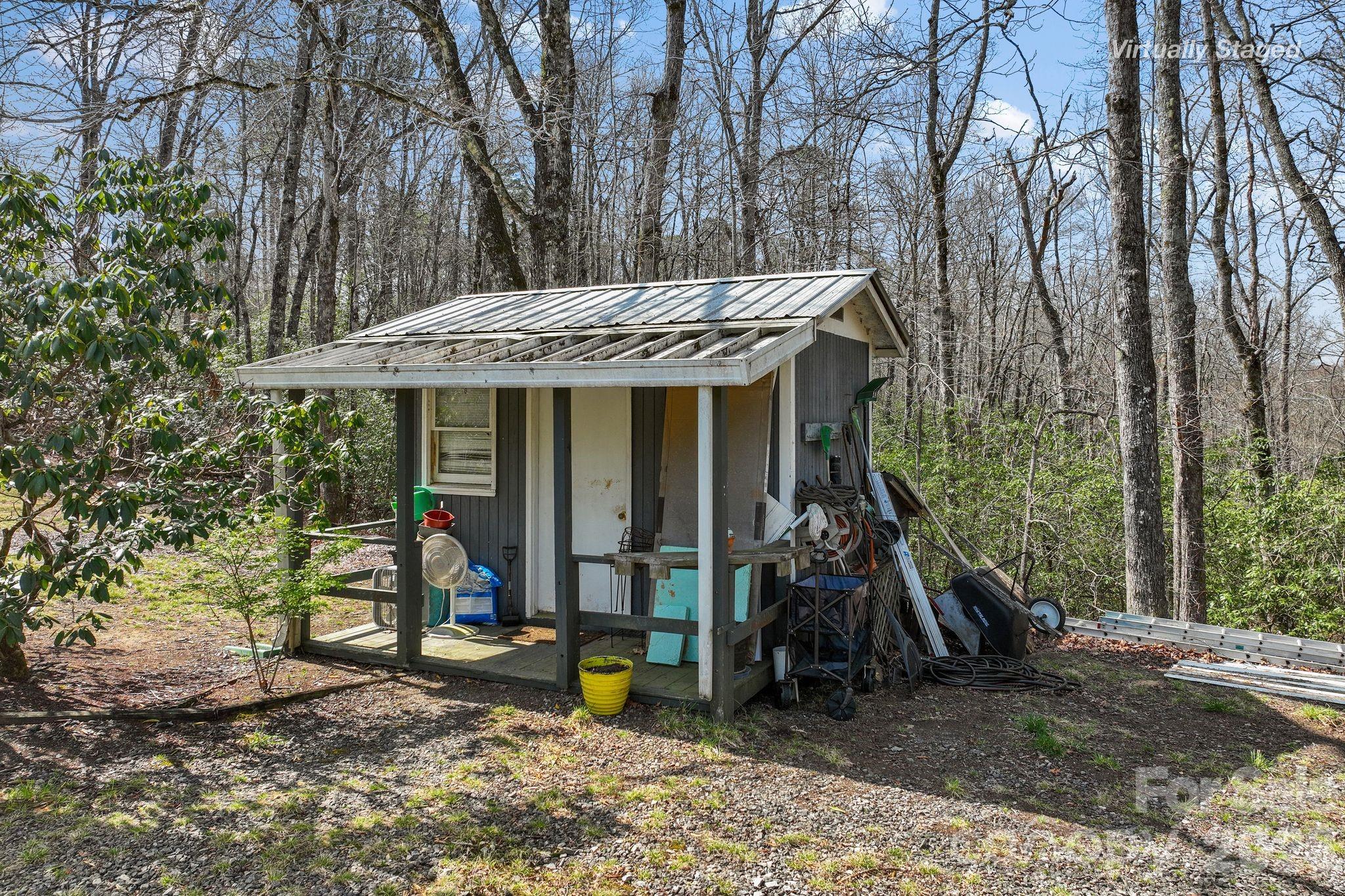 54 South Kimiko Lane Balsam Grove, NC 28708 - Photo 6 of 46 a view of a house with a tree and wooden fence