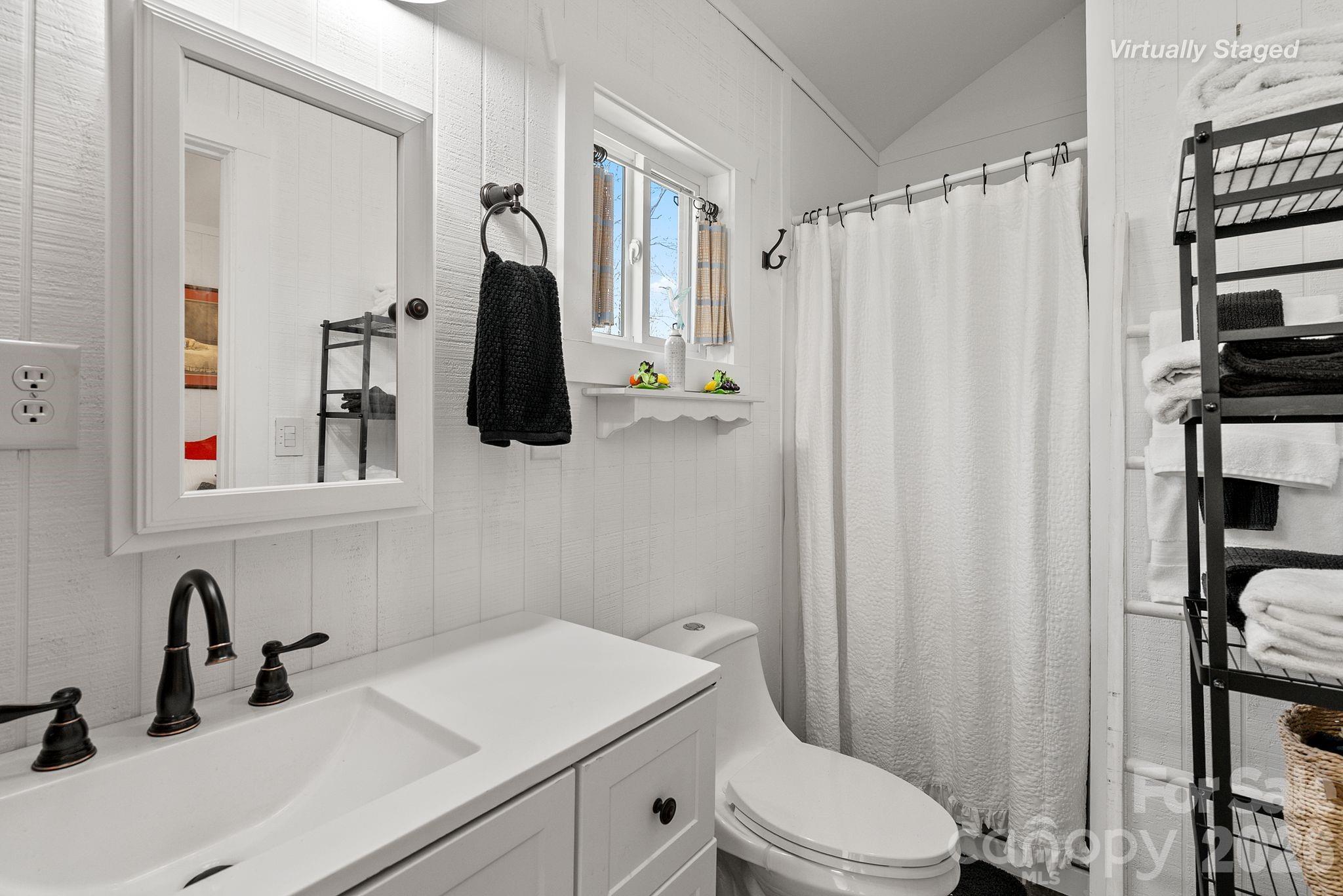54 South Kimiko Lane Balsam Grove, NC 28708 - Photo 10 of 46 a bathroom with a sink toilet and shower