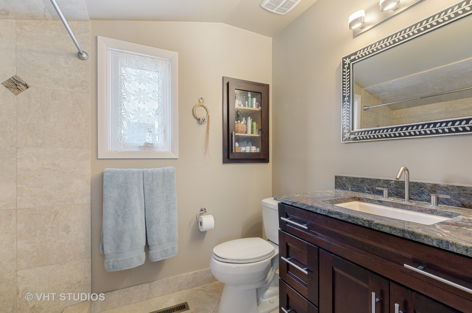 1246 Ridge Road Highland Park, IL 60035 - Photo 13 of 22 a bathroom with a granite countertop toilet sink and mirror