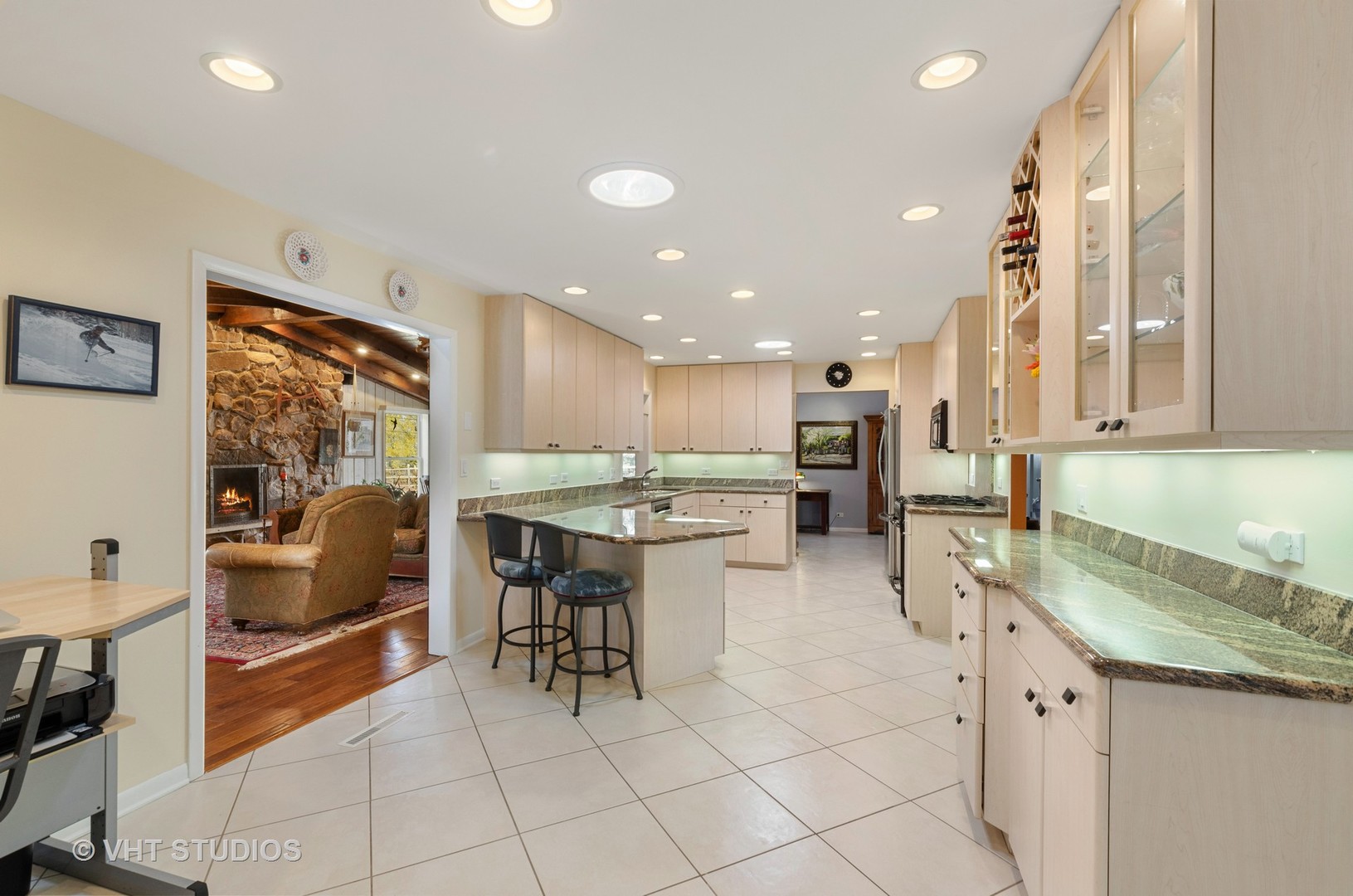 1246 Ridge Road Highland Park, IL 60035 - Photo 5 of 22 a kitchen with stainless steel appliances kitchen island granite countertop a sink and cabinets
