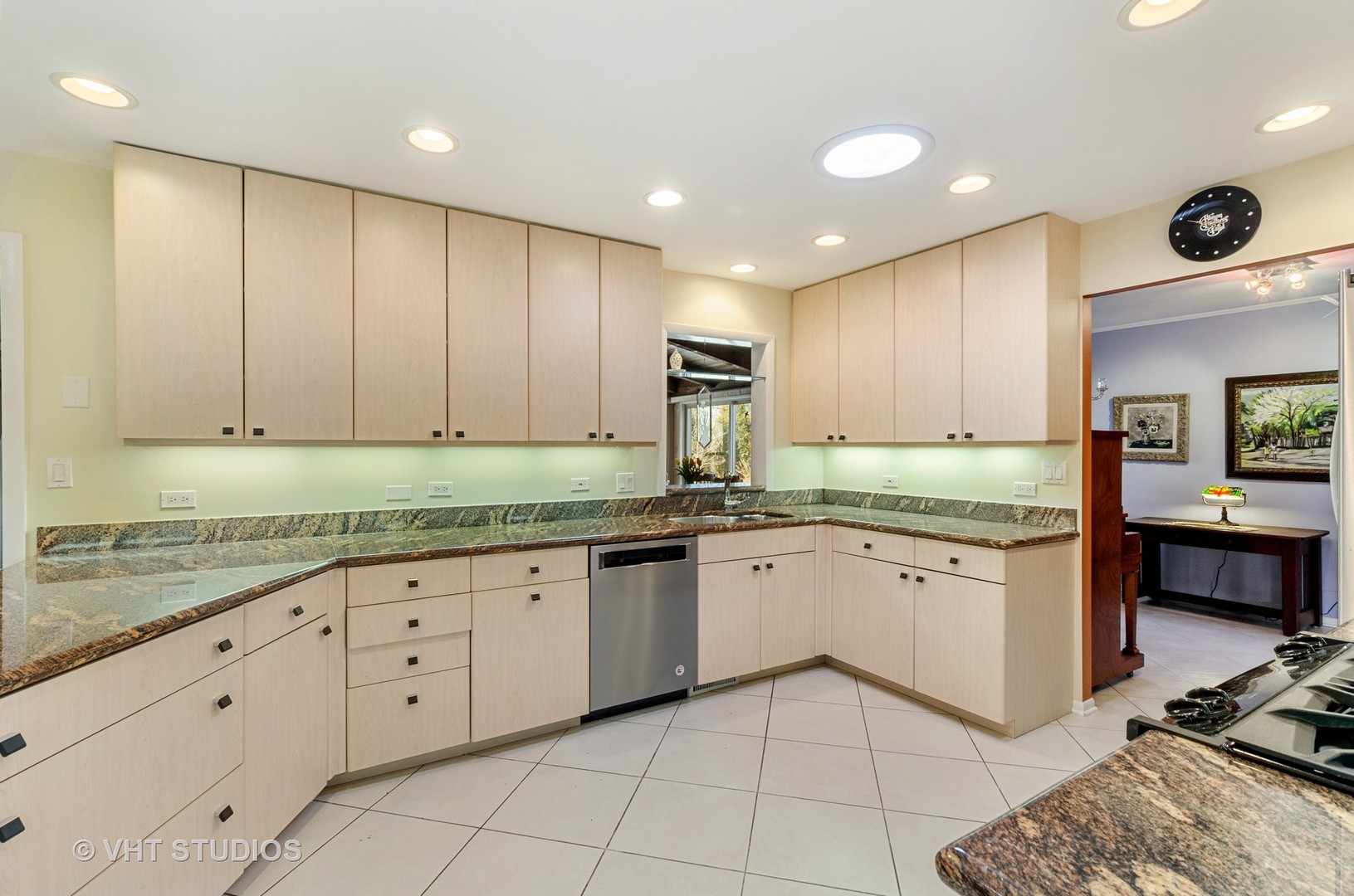 1246 Ridge Road Highland Park, IL 60035 - Photo 6 of 22 a large kitchen with granite countertop a sink and dishwasher a stove with wooden cabinets