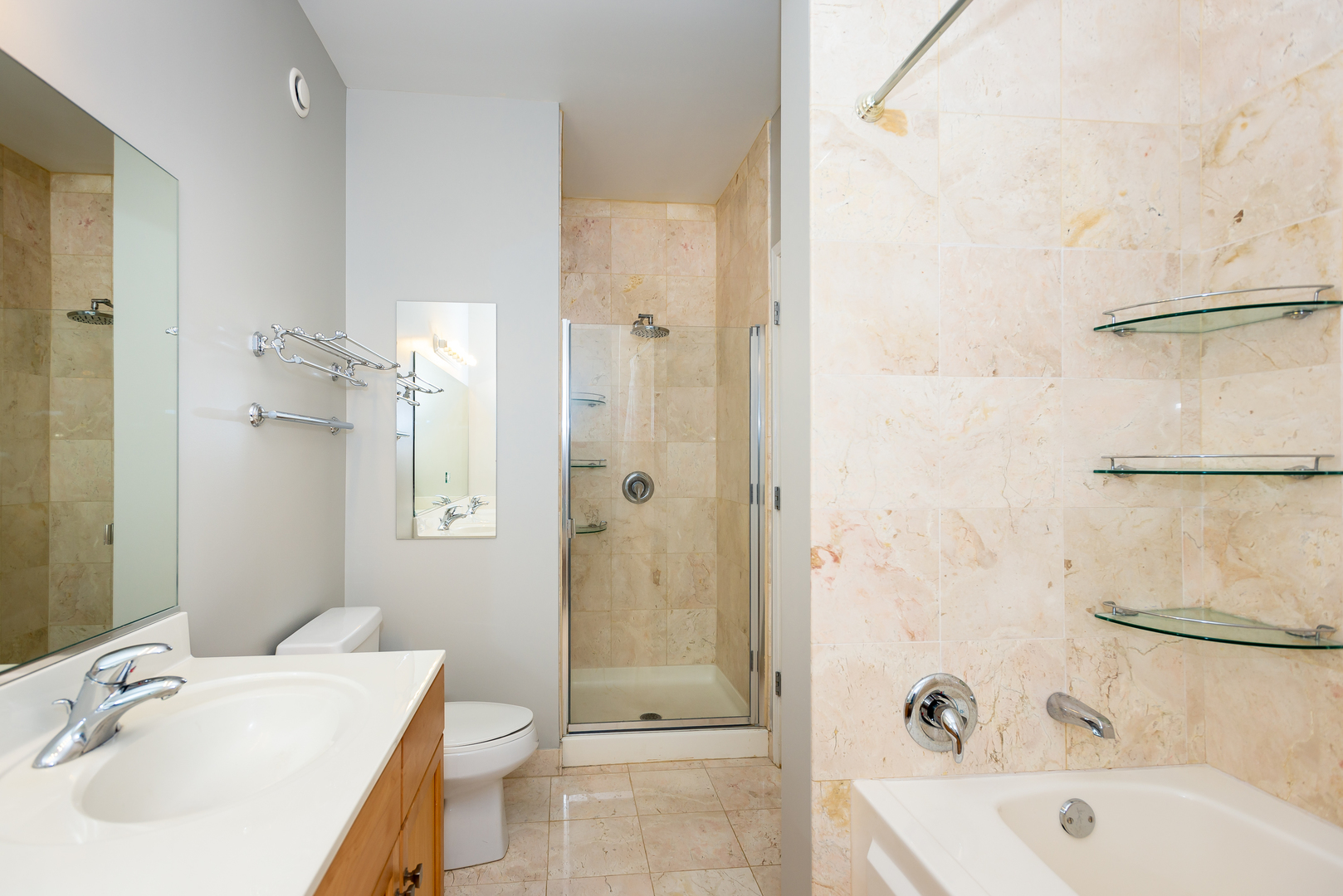1101 South State Street, Unit 1804 Chicago, IL 60605 - Photo 15 of 29 a bathroom with a sink toilet and shower
