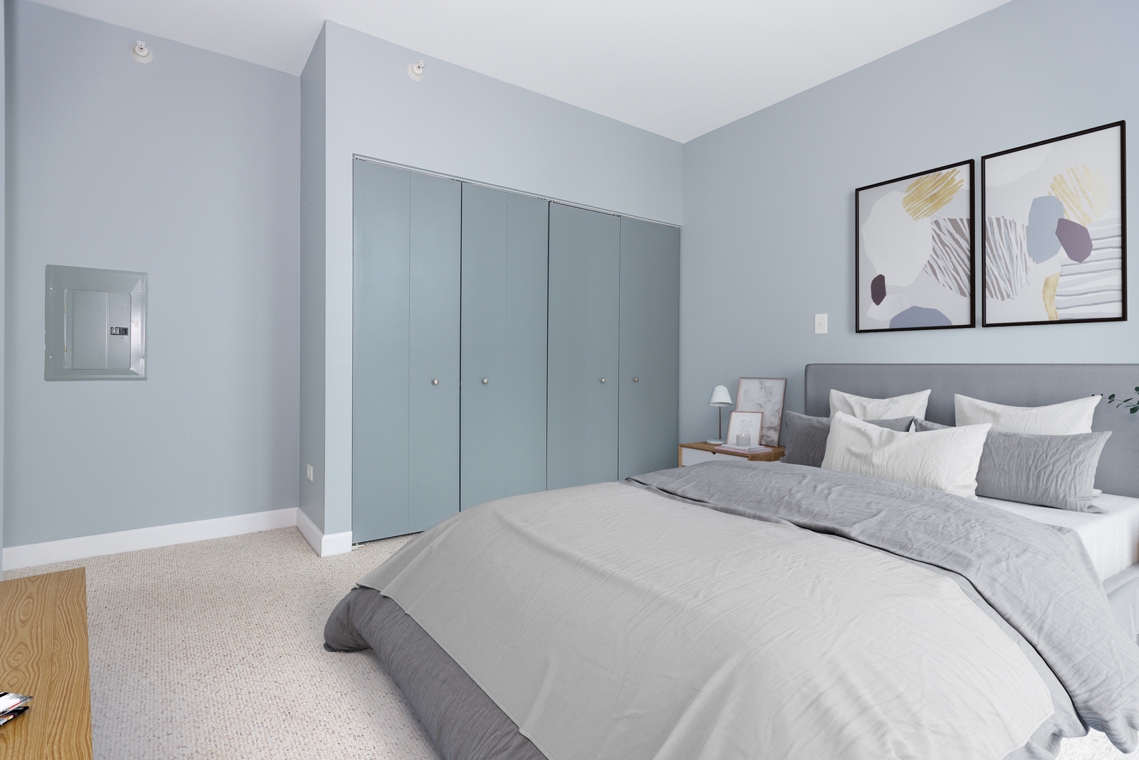 1101 South State Street, Unit 1804 Chicago, IL 60605 - Photo 18 of 29 a bedroom with a bed and a painting on the wall
