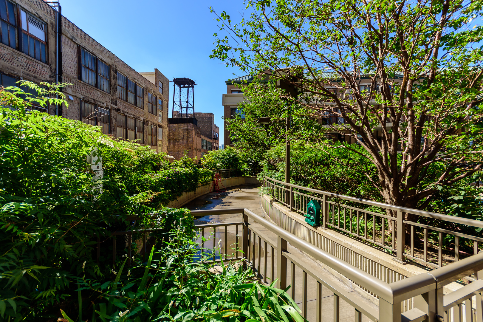 1101 South State Street, Unit 1804 Chicago, IL 60605 - Photo 28 of 29 a balcony with plants and large trees