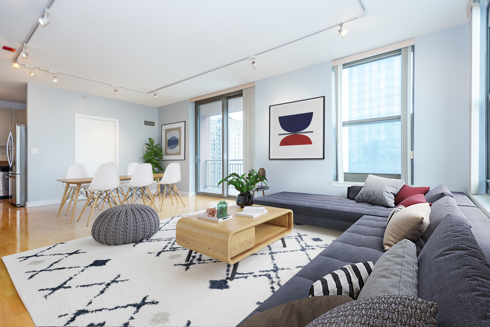 1101 South State Street, Unit 1804 Chicago, IL 60605 - Photo 4 of 29 a living room with furniture a rug and a window