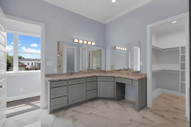 a large bathroom with a sink and a mirror