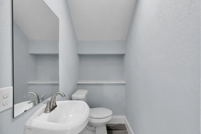a bathroom with a sink and a toilet