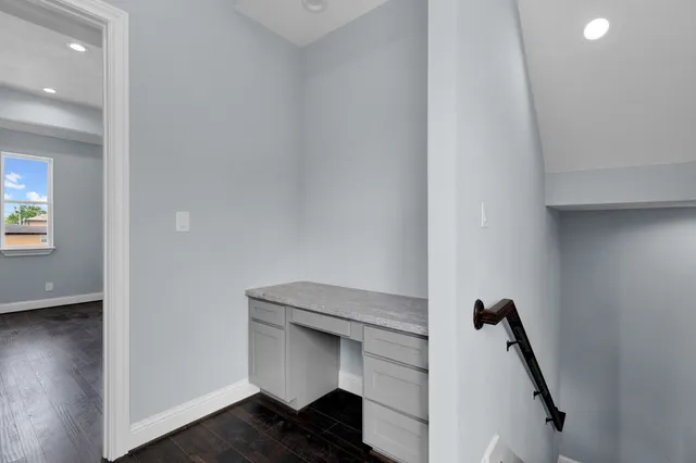 a view of staircase with wooden floor
