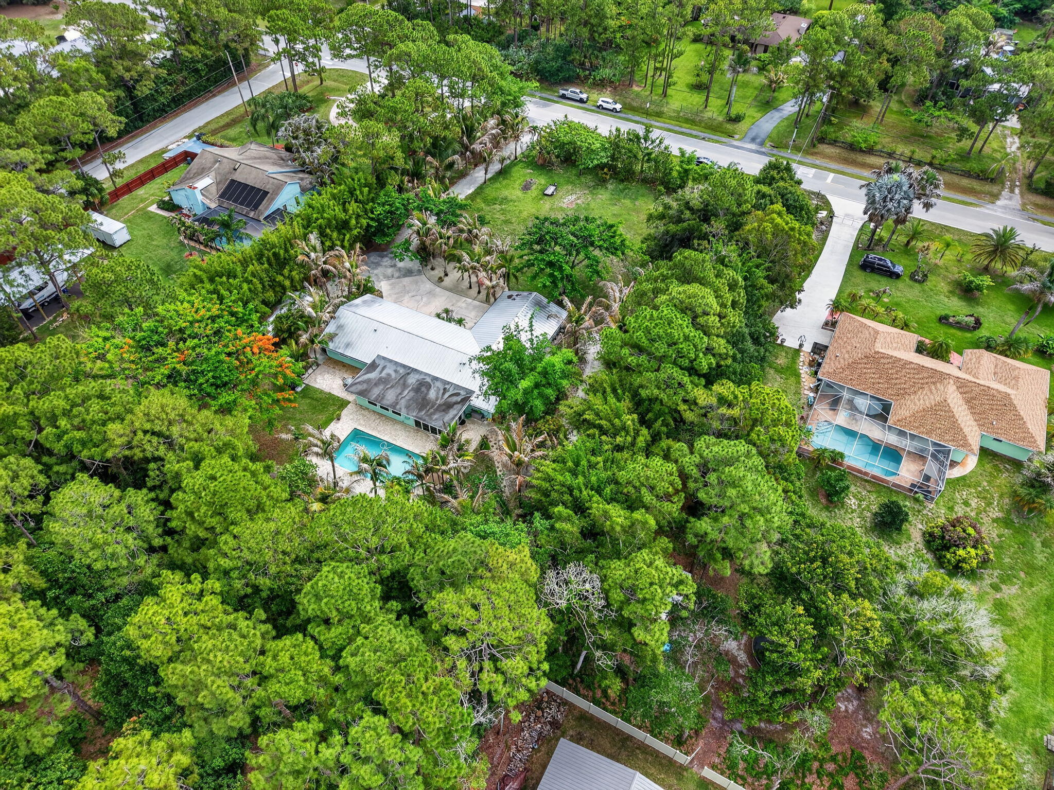 17391 Alexander Run Jupiter, FL 33478 - Photo 53 of 55 an aerial view of residential house with outdoor space and trees all around