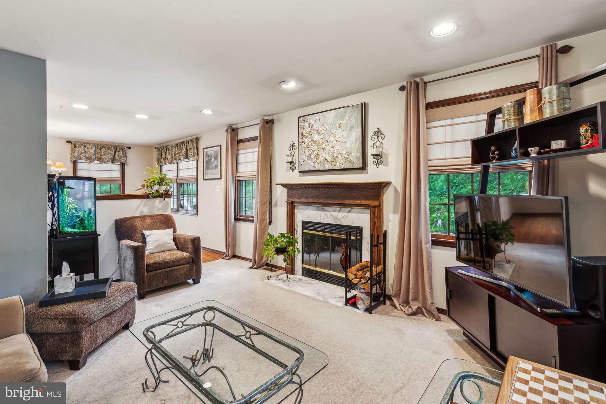 28 Gettysburg Drive Voorhees, NJ 08043 - Photo 21 of 50 a living room with furniture and a fireplace