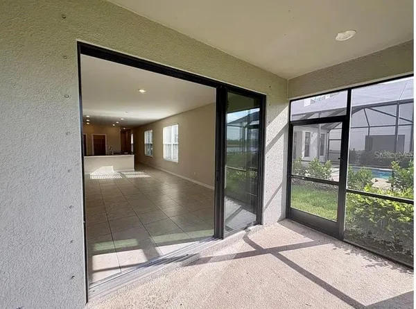 a view of a glass door of the house