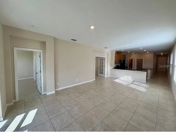 a view of a hallway with a bathroom