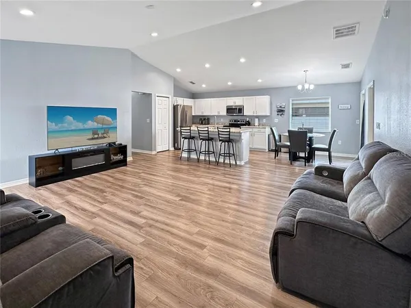 a living room with furniture and a flat screen tv