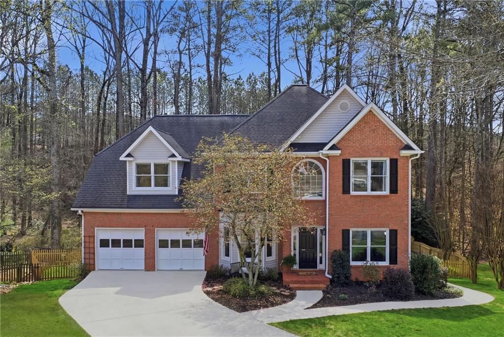 60 Gilbert Circle Northeast Suwanee, GA 30024 - Photo 1 of 47 a front view of a house with garden