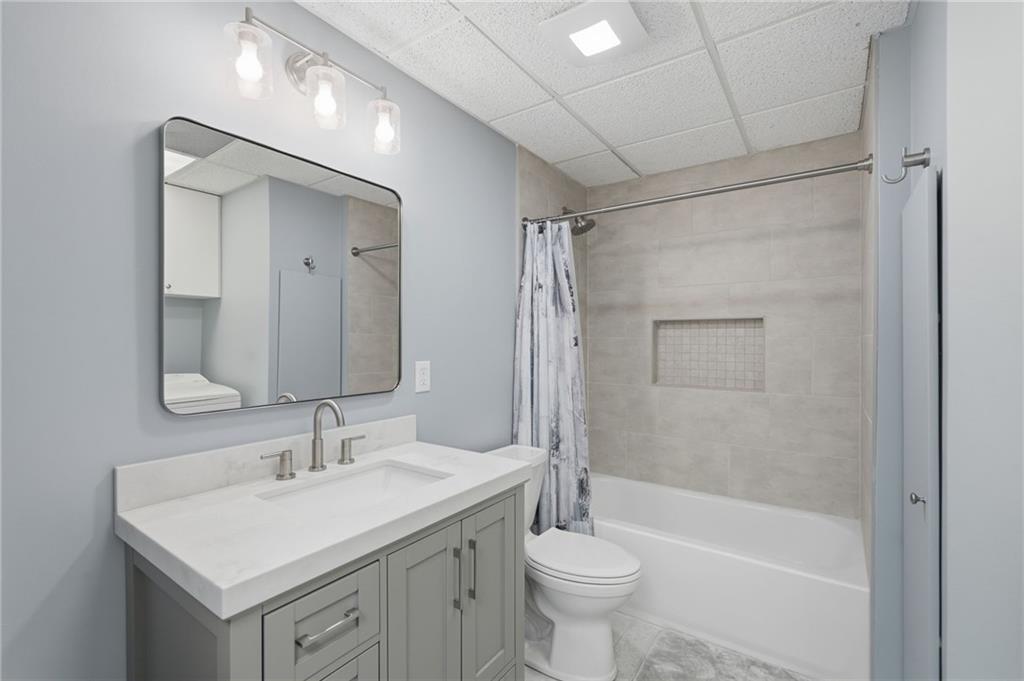 60 Gilbert Circle Northeast Suwanee, GA 30024 - Photo 29 of 47 a bathroom with a sink toilet and shower