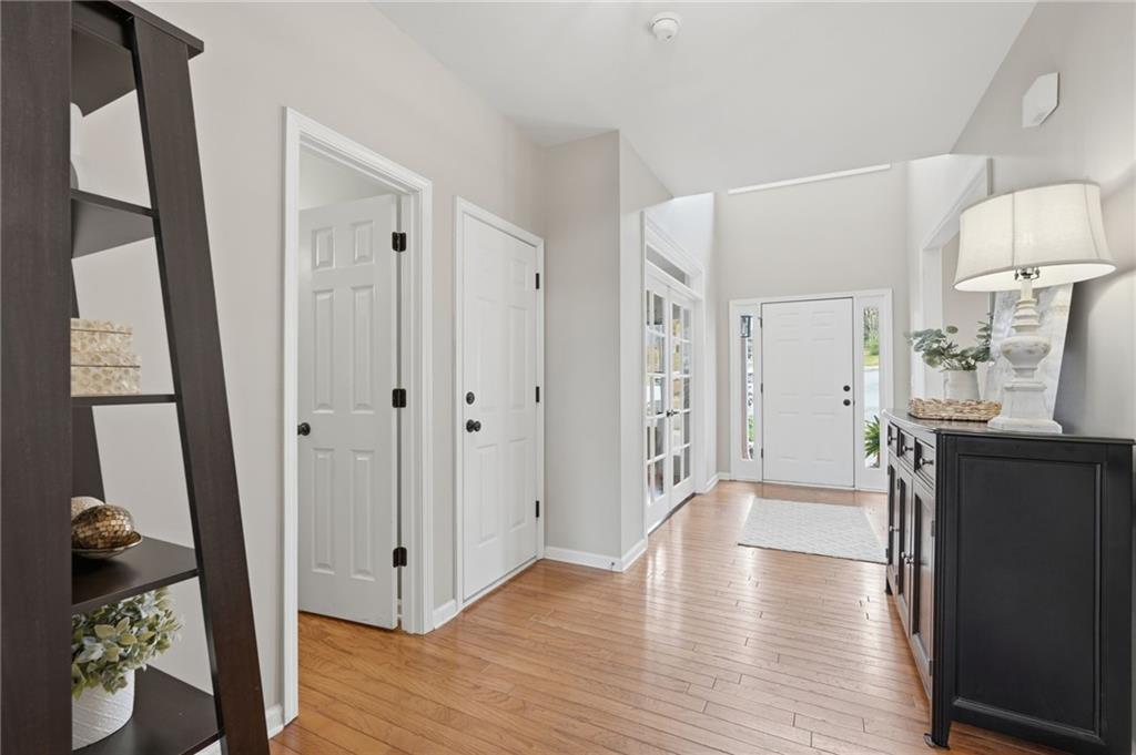 60 Gilbert Circle Northeast Suwanee, GA 30024 - Photo 3 of 47 a view of a hallway view with wooden floor and staircase