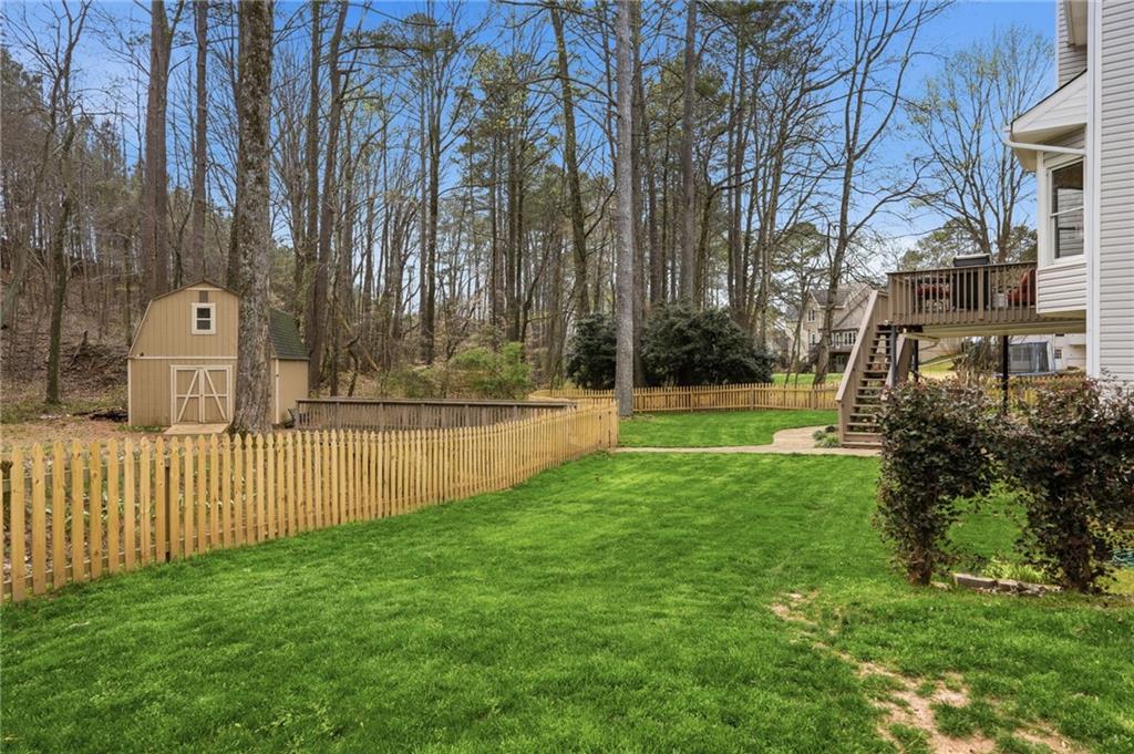 60 Gilbert Circle Northeast Suwanee, GA 30024 - Photo 37 of 47 a view of a garden with trees