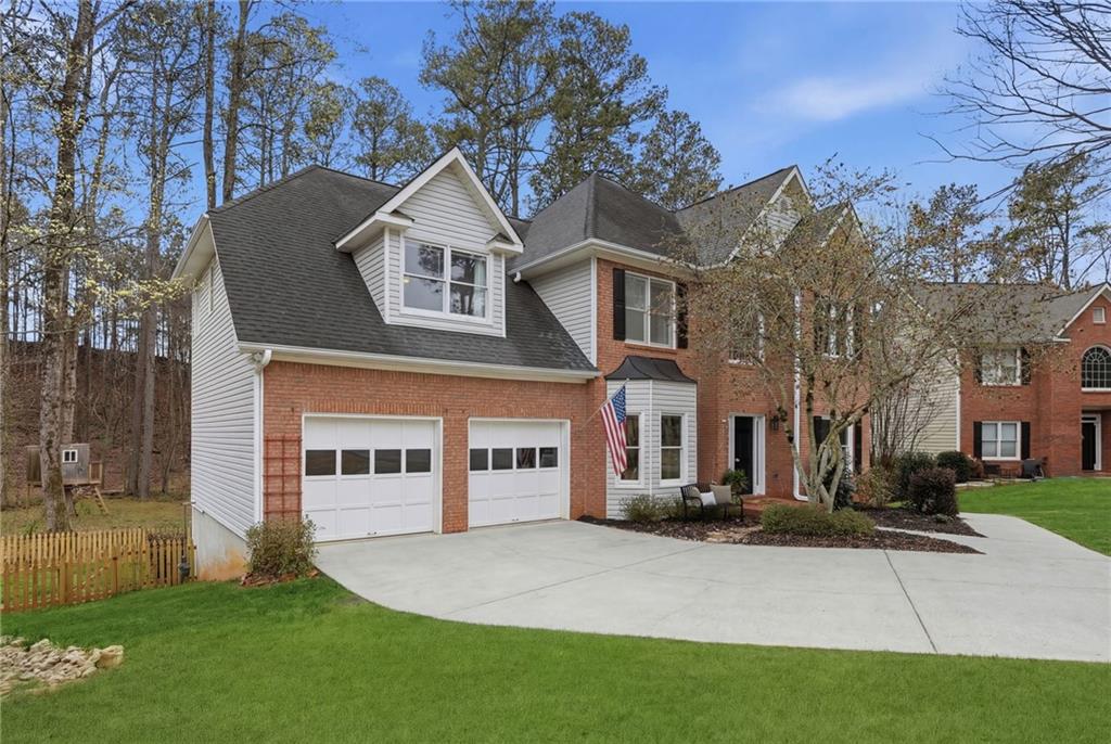 60 Gilbert Circle Northeast Suwanee, GA 30024 - Photo 41 of 47 a front view of a house with a yard