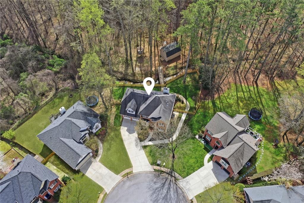 60 Gilbert Circle Northeast Suwanee, GA 30024 - Photo 42 of 47 an aerial view of a house with garden space and street view