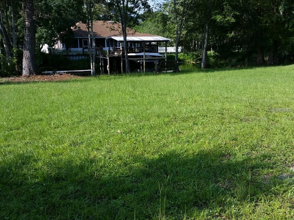 Canal View - lot grassed and cleared