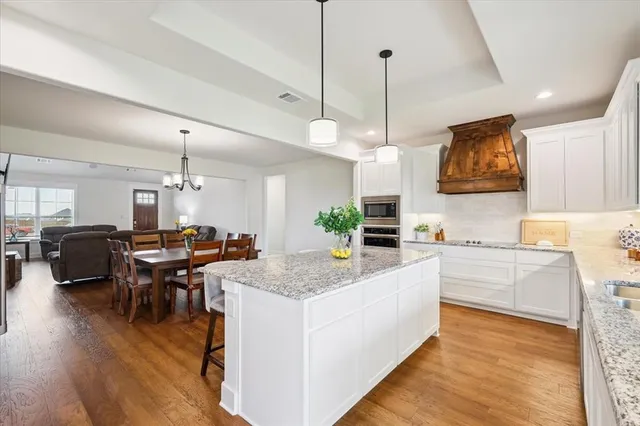 a kitchen with sink and cabinets