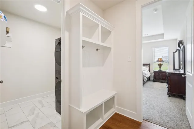 a bedroom with a bed couch and a window