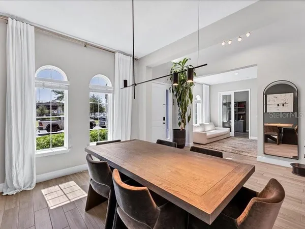 a view of a dining room with furniture and window