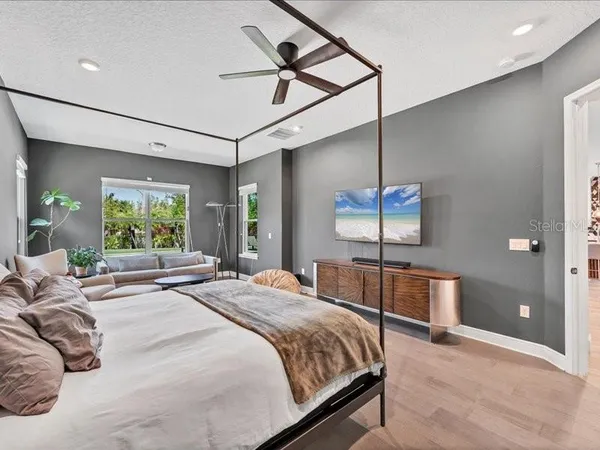 a bedroom with a bed and window
