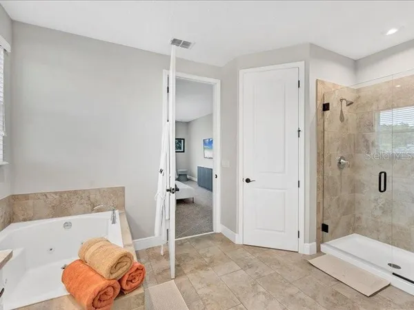 a bathroom with a tub and shower