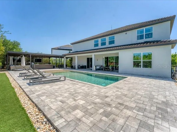 a view of a house with swimming pool