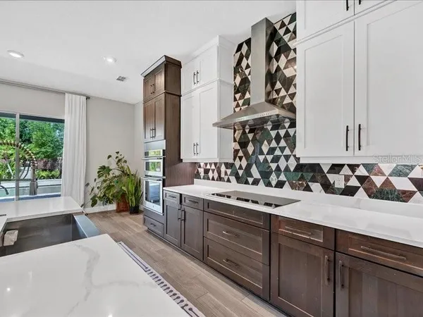 a view of a double vanity sink and a window