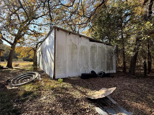 a view of a back yard of the house