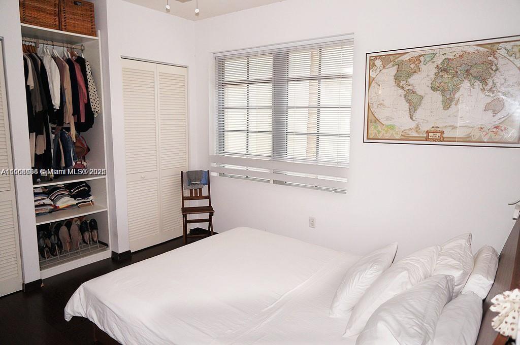 435 21st Street, Unit 215 Miami Beach, FL 33139 - Photo 11 of 14 a bedroom with a bed and a window